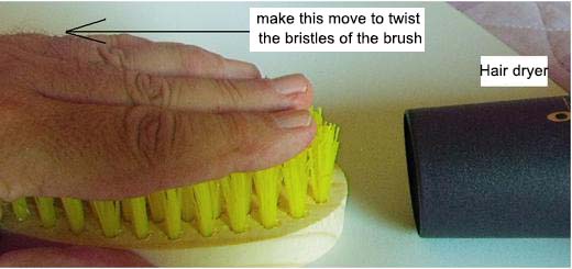 Figure 9 - Bending the bristles with hot air.
